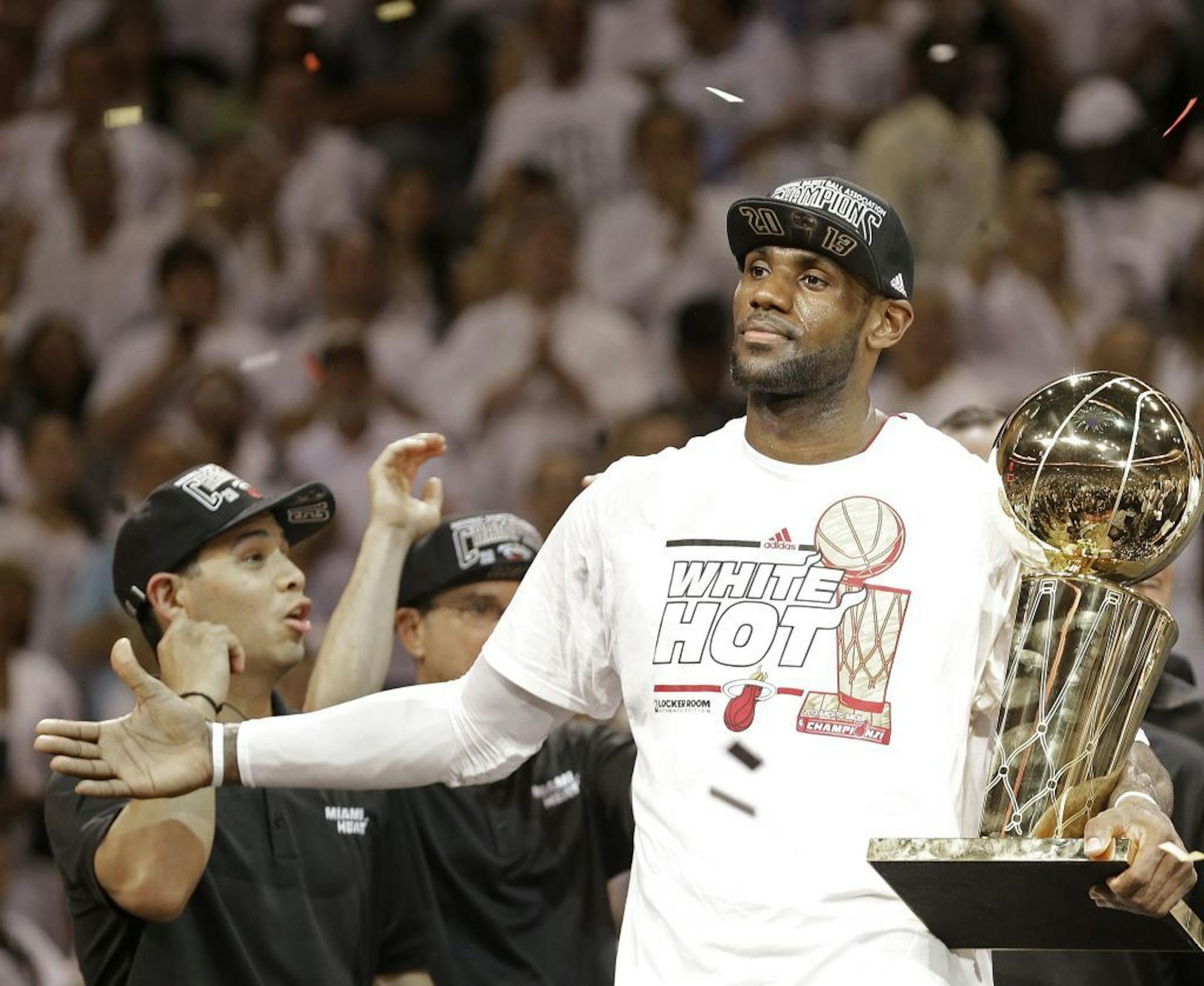 LeBron James holds the the Larry O'Brien NBA Championship Trophy after Game 7 of the NBA Finals against the San Antonio Spurs