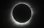 FILE - This March 9, 2016 file photo shows a total solar eclipse in Belitung, Indonesia. Wyoming state tourism officials say the solar eclipse passing