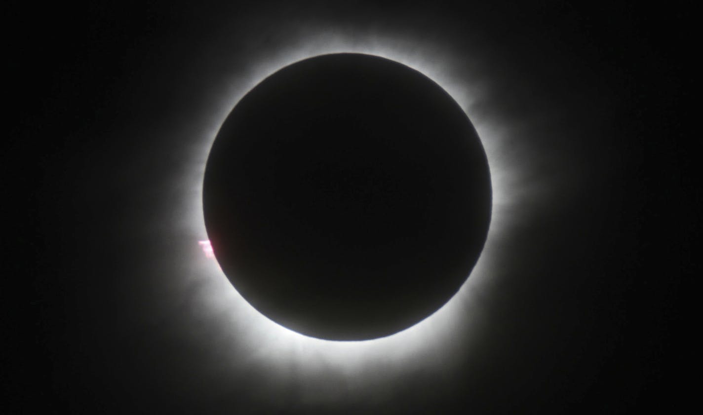 FILE - This March 9, 2016 file photo shows a total solar eclipse in Belitung, Indonesia. Wyoming state tourism officials say the solar eclipse passing over the entire length of Wyoming in August could give the state economy a much needed boost. (AP Photo, File) ORG XMIT: LA301