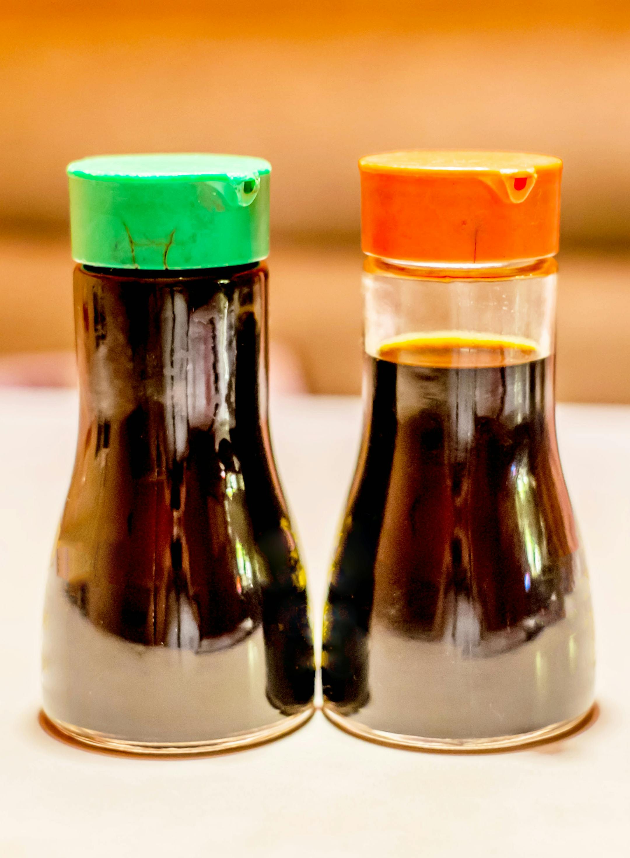 Two soy sauce bottles on the table. istock