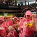 Breast cancer survivors Deborah Tavernier, left, and Mary Jane Kruse, right, got tangled in confetti as they participated in the survivor ceremony at 