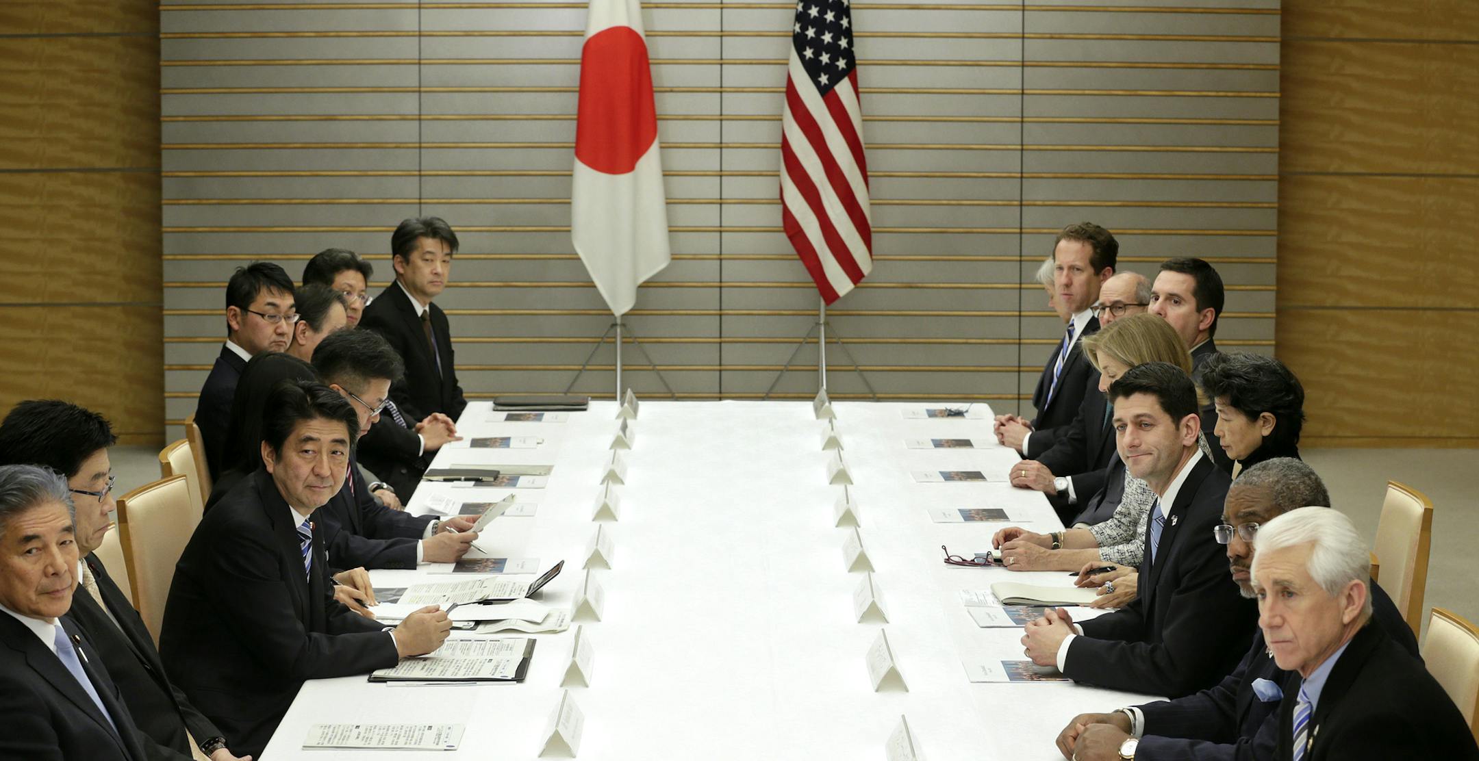 U.S. Rep. Paul Ryan, R-Wis., third right, chairman of the House Ways and Means Committee, leading a delegation of U.S. lawmakers, talks with Japanese Prime Minister Shinzo Abe, third left, at Abe's official residence in Tokyo, Thursday, Feb. 19, 2015. Ryan and seven other lawmakers met Thursday with Prime Minister Abe and other top Japanese officials, promoting the U.S.-led Trans-Pacific Partnership, or TPP.(AP Photo/Kimimasa Mayama, Pool)