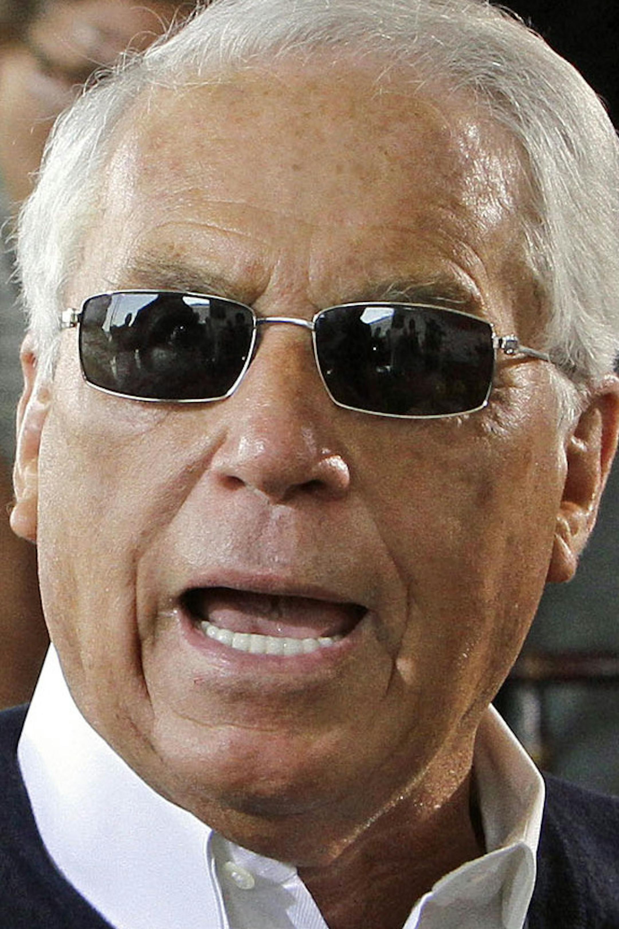 Hall of Fame trainer D. Wayne Lukas talks with Jim Barnes from the Bob Baffert stables during the Preakness Stakes post position draw at Pimlico Race Course in Baltimore, Wednesday, May 15, 2013. Lukas will send three horses to the gate in Saturday's Preakness Stakes horse race. (AP Photo/Garry Jones)