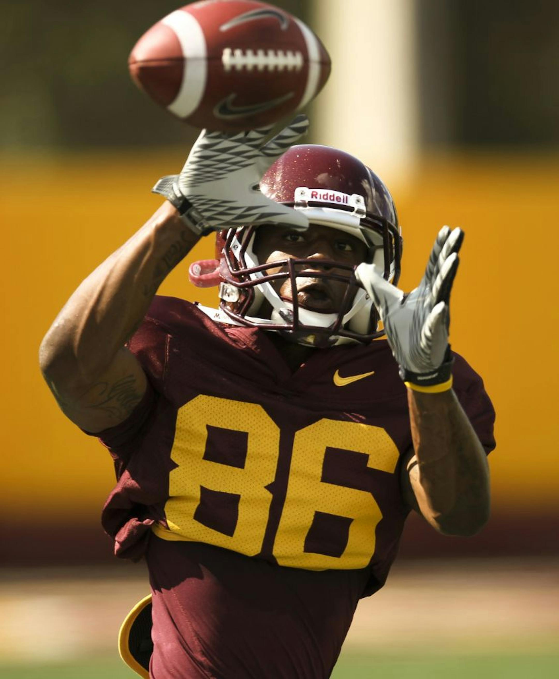 Gophers sophomore wide receiver Malcolm Moulton looked a pass into his hands during practice on Thursday.