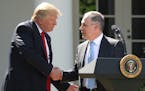 FILE - In this June 1, 2017 file photo, President Donald Trump shakes hands with EPA Administrator Scott Pruitt after speaking about the U.S. role in 