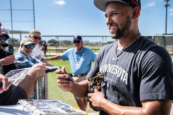 Royce Lewis autographed baseball cards for Twins fans Wednesday in Fort Myers, Fla.