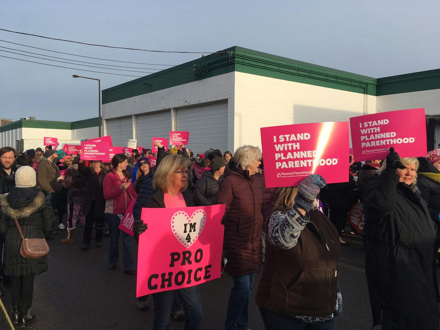 Protesters who support Planned Parenthood gather at a Planned Parenthood facility Saturday morning in St. Paul.