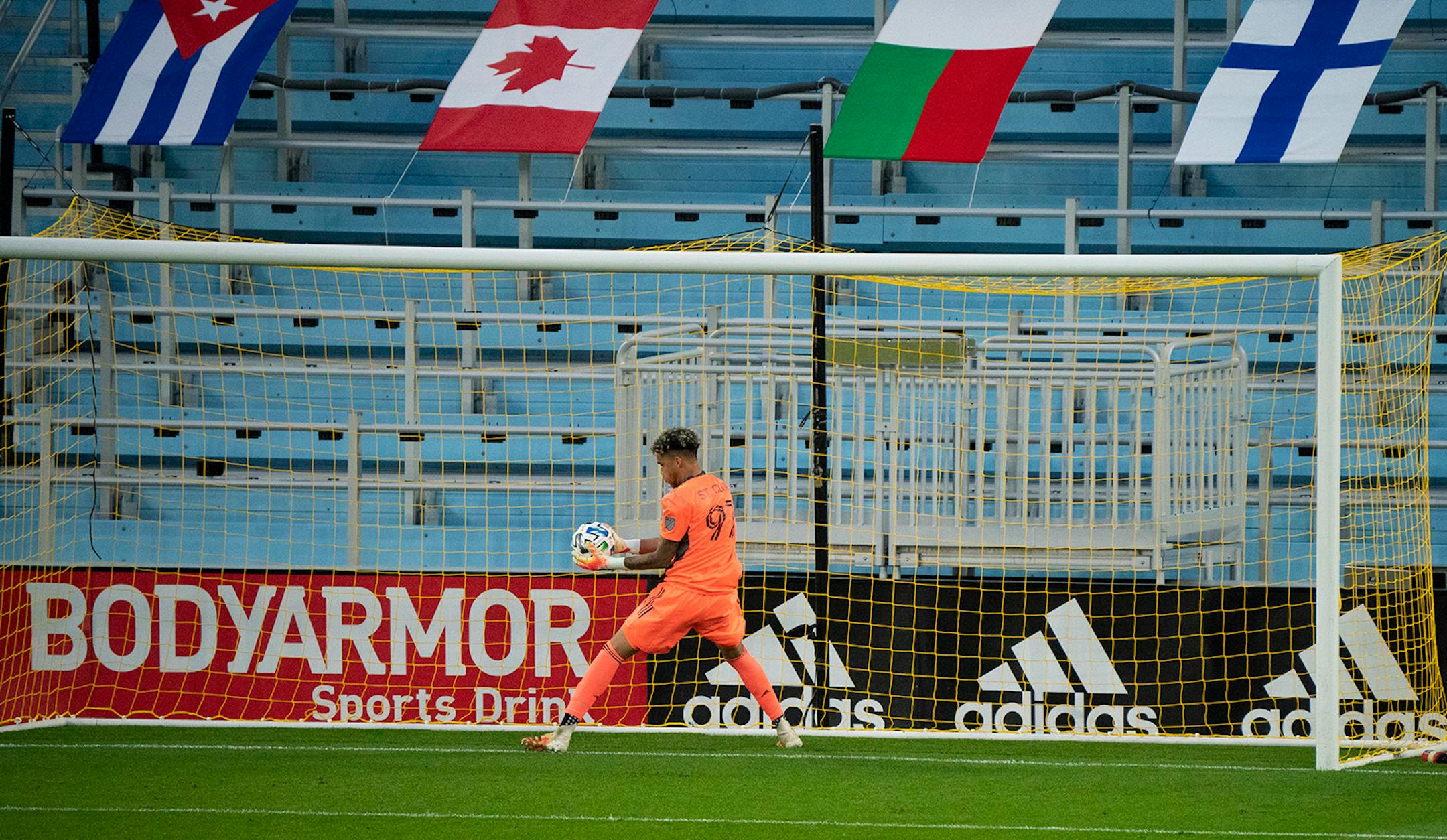 Minnesota United goalkeeper Dayne St. Clair (97) held the ball out from the goal after it bounced towards the net after he made a first half save.