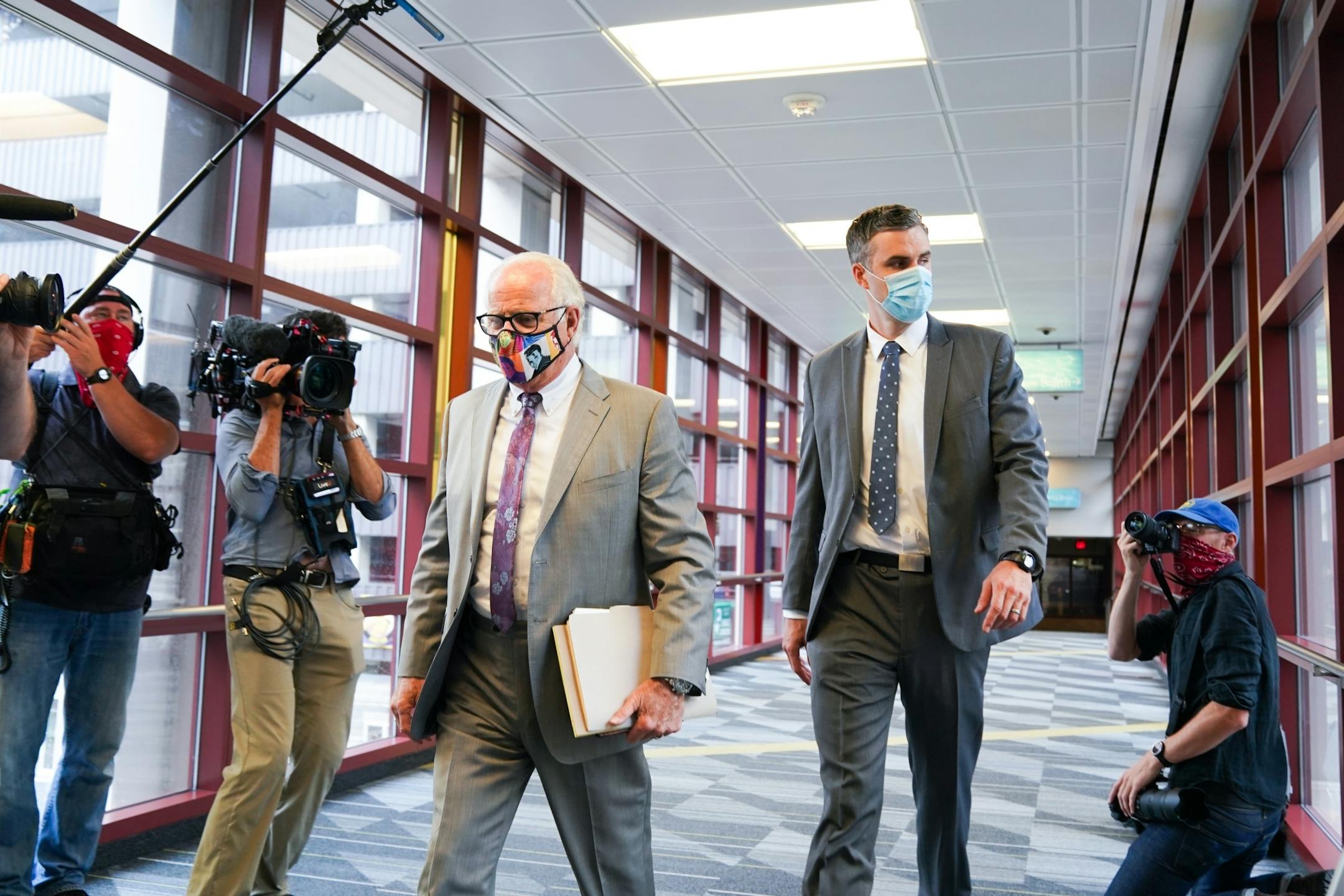 Former Minneapolis police officer Thomas Lane, right, entered the Hennepin County Public Safety Facility Monday morning with his attorney Earl Gray, left.
