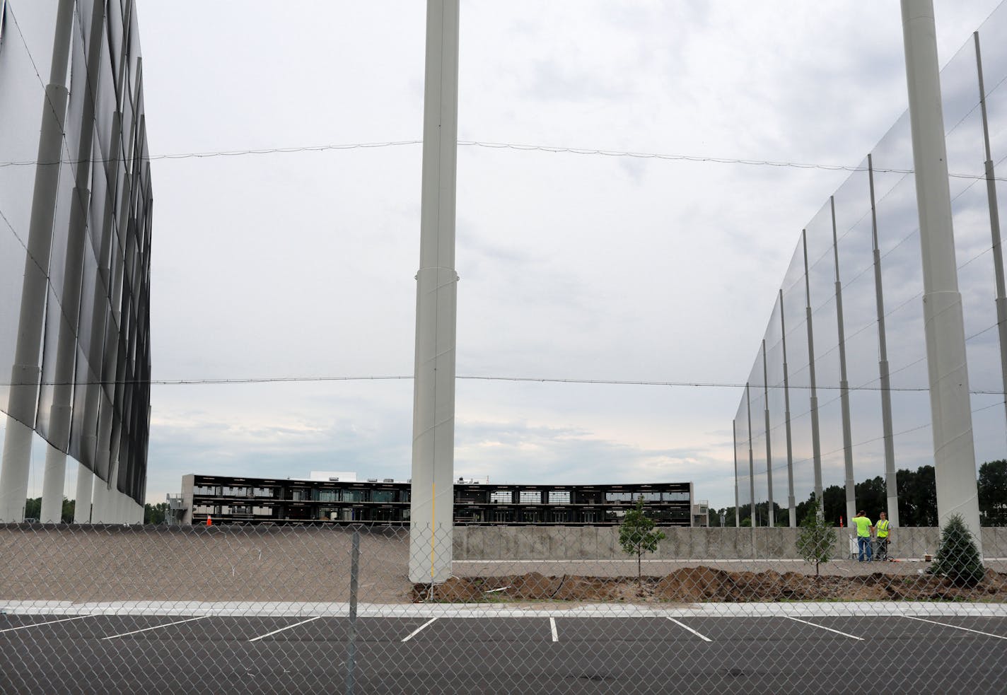 A multi-tiered golf driving range called Topgolf is staging "ambition auditions" for the 500 or so jobs they need to fill before opening the high-tech center later this year in Brooklyn Center. Here, workers on the site Tuesday, July 201, 2018, in Brooklyn Center, MN.] DAVID JOLES &#xef; david.joles@startribune.com A multi-tiered golf driving range called Topgolf is staging "ambition auditions" for the 500 or so jobs they need to fill before opening the high-tech center later this year in Brookl