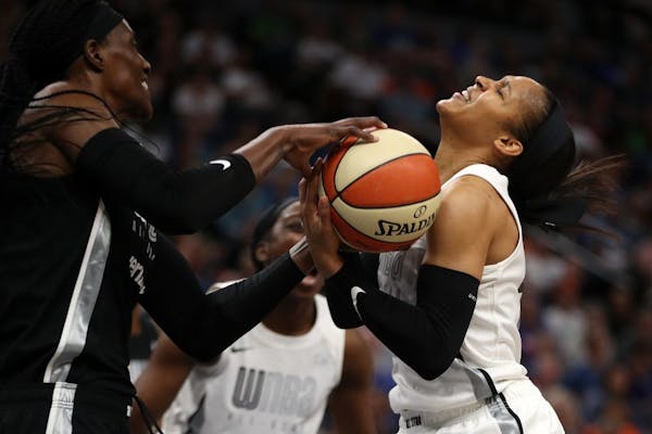 Lynx teammates Maya Moore (right) and Sylvia Fowles (left), on different sides in the WNBA All-Star Game, battled for a loose ball. Moore was named th
