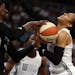 Lynx teammates Maya Moore (right) and Sylvia Fowles (left), on different sides in the WNBA All-Star Game, battled for a loose ball. Moore was named th