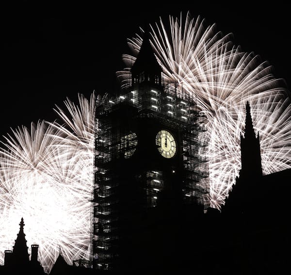 Fireworks explode over the River Thames behind the Elizabeth Tower which contains the bell know as "Big Ben", at the Houses of Parliament in London, a