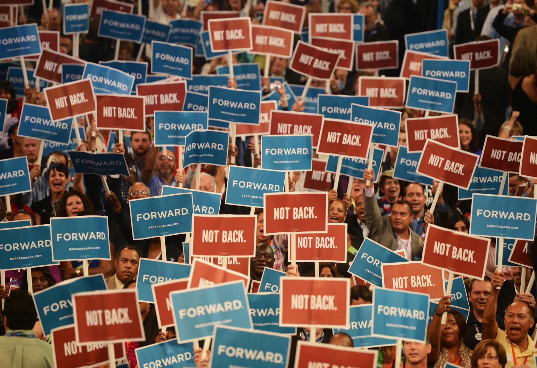 Delegates hold up signs as Maryland Governor Martin O'Malley speaks to the delegates at the 2012 Democratic National Convention at the Time Warner Cable Arena in Charlotte, North Carolina, Tuesday, September 4, 2012.