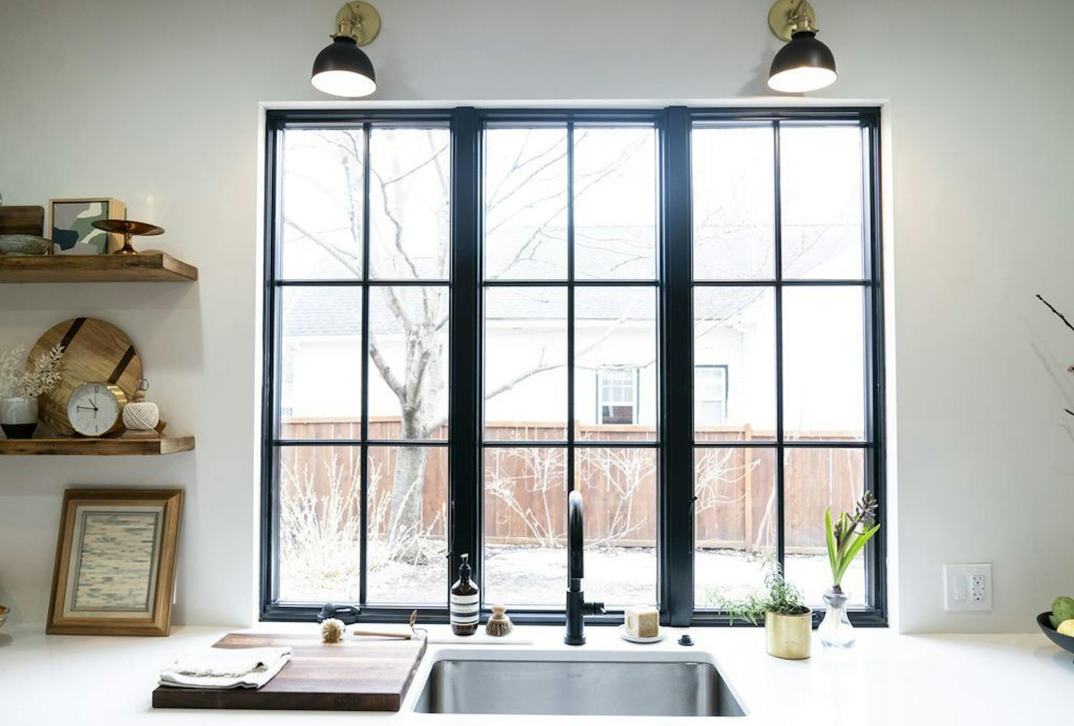 A new frameless picture window is above the sink.