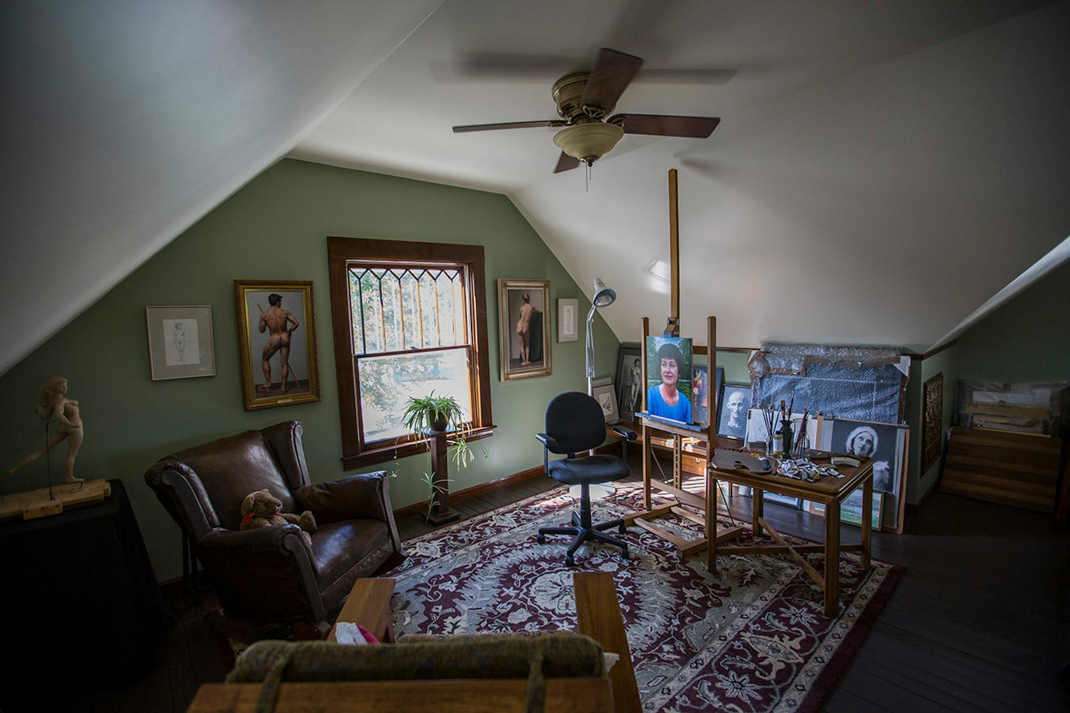 The 470-square-foot attic was transformed into an artists' studio on one side and a TV room on the other.