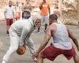 This image released by Summit Entertainment shows Boston Celtics basketball player Kyrie Irving, left, portraying Uncle Drew in a scene from the comed
