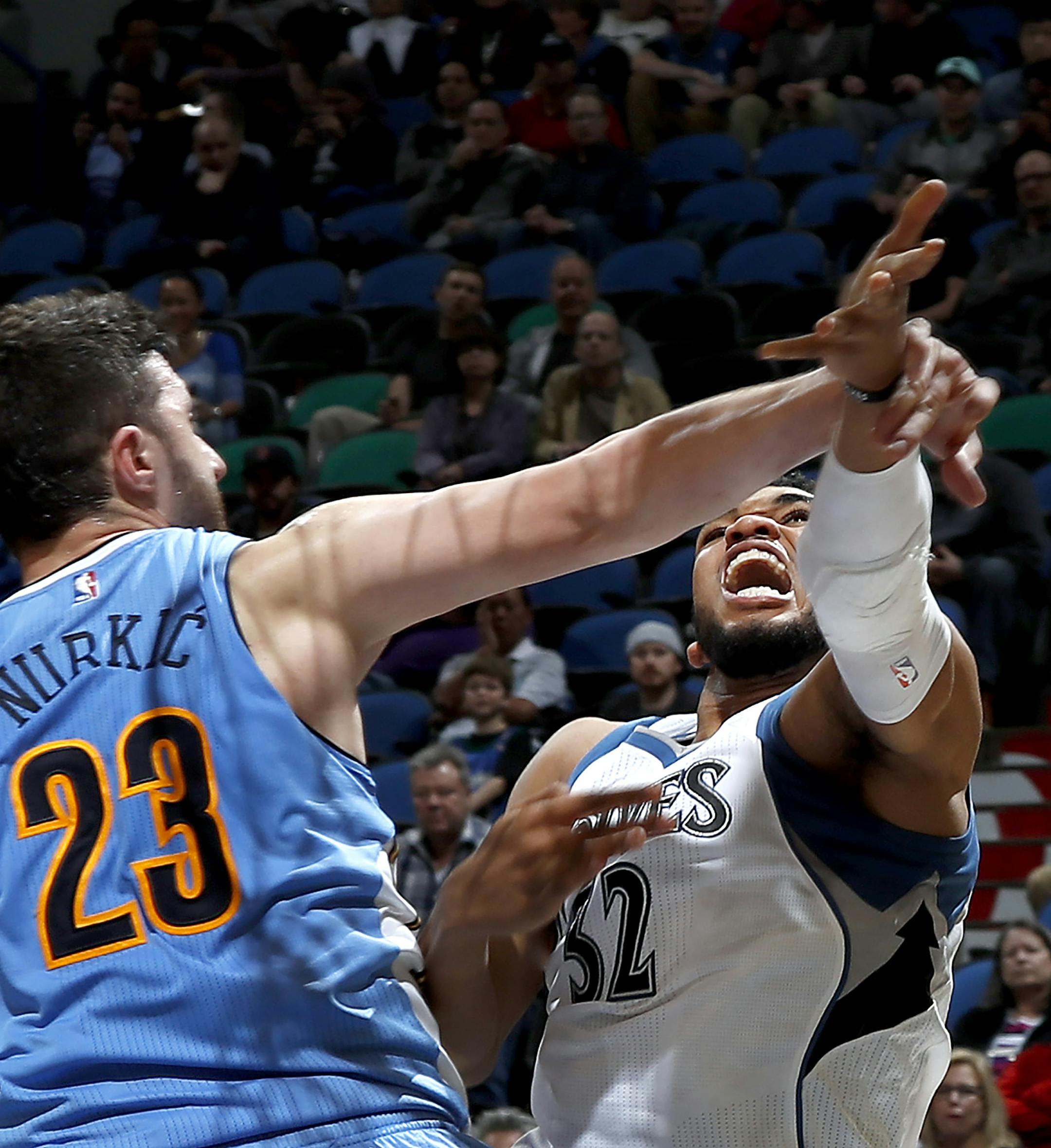 Karl-Anthony Towns (32) was fouled by Jusuf Nurkic (23) in the second quarter. ] CARLOS GONZALEZ cgonzalez@startribune.com - November 3, 2016, Minneapolis, MN, Target Center, NBA, Minnesota Timberwolves vs. Denver Nuggets