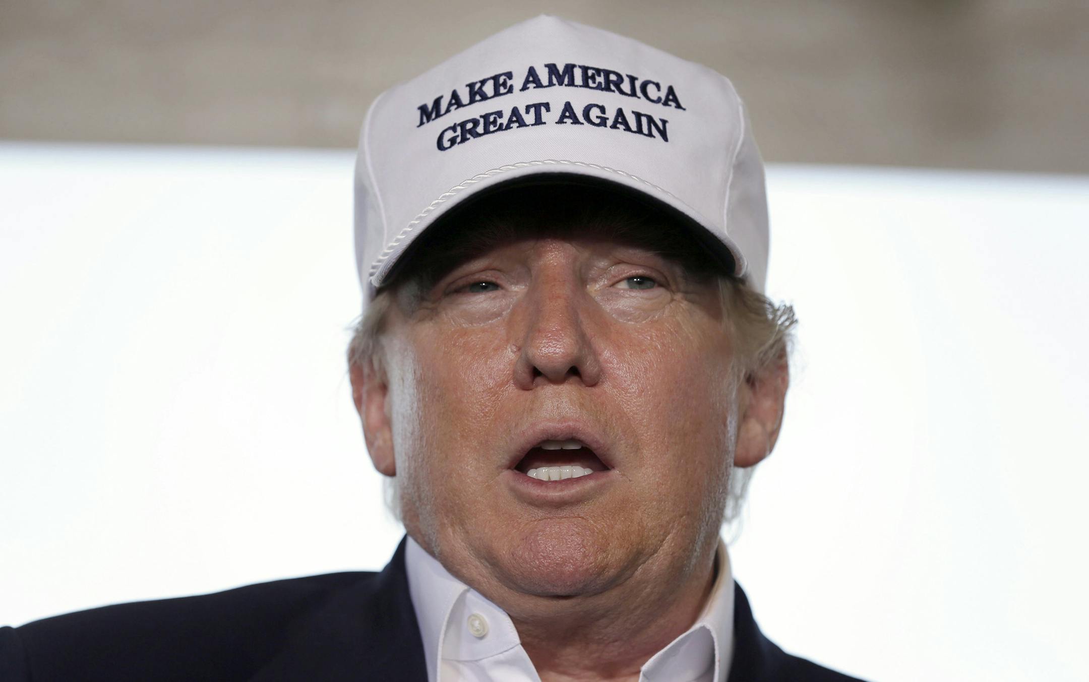 Republican presidential hopeful Donald Trump speaks to the media during a tour of the the World Trade International Bridge at the U.S. Mexico border in Laredo, Texas, Thursday, July 23, 2015. Trump predicted Hispanics would love him, "they already do," because as president he'd grab jobs back from overseas and give more opportunity to those who live in the U.S. legally. (AP Photo/LM Otero) ORG XMIT: TXMO117