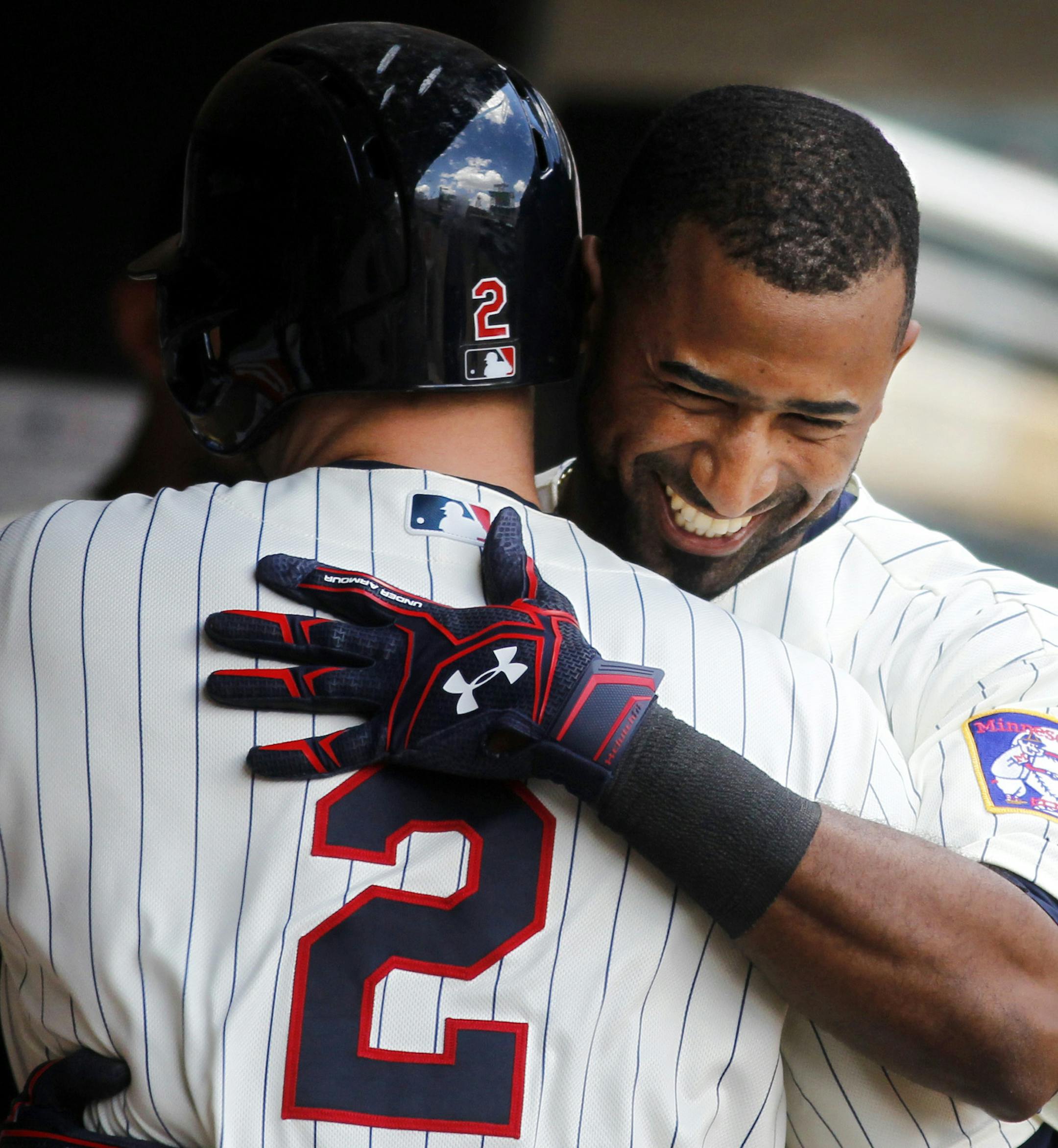 The Twins’ Eduardo Nunez celebrated after scoring on a sacrifice fly by Brian Dozier (2) in the fifth inning Saturday.