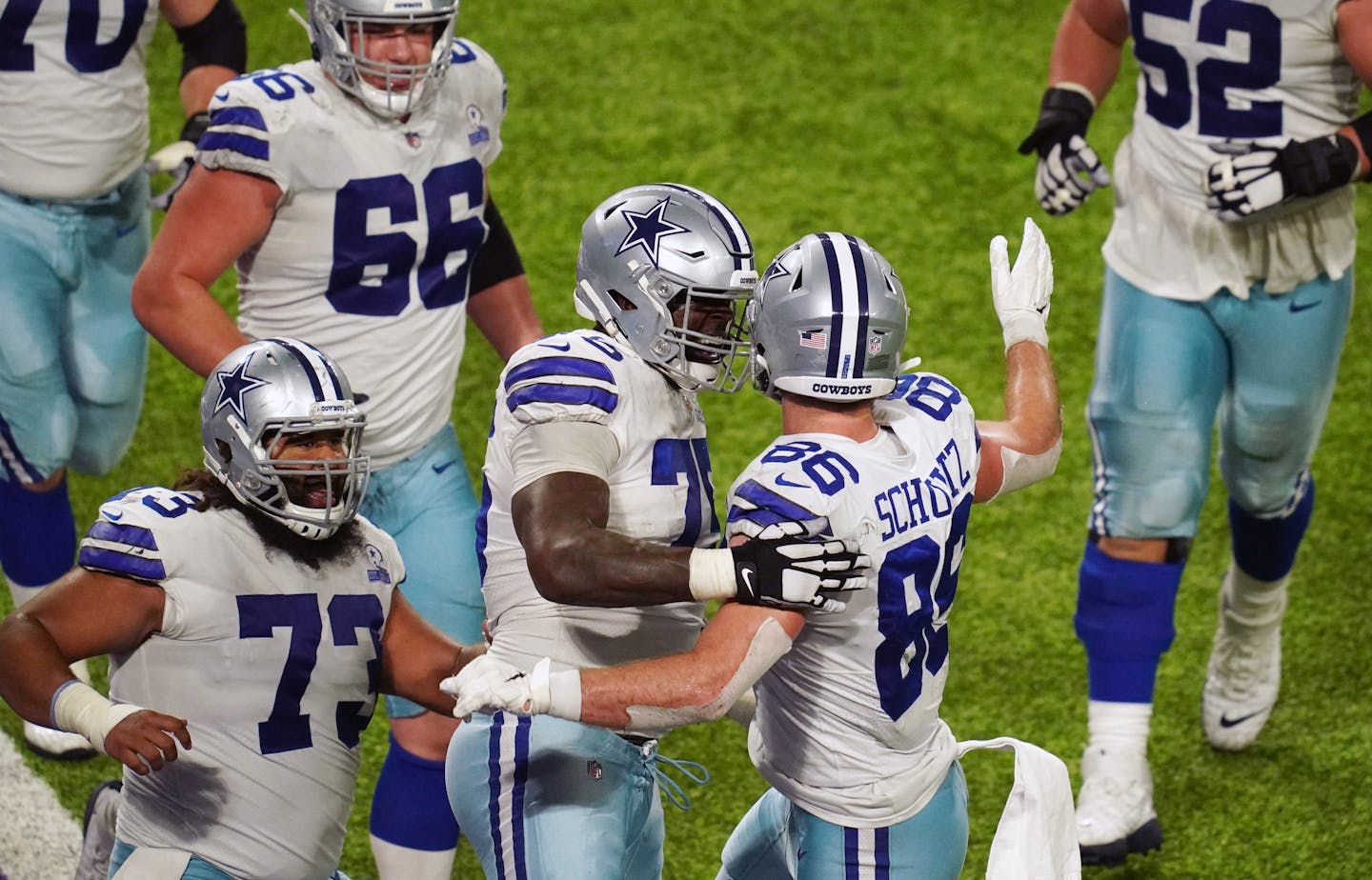 Dallas Cowboys tight end Dalton Schultz (86) celebrated with his teammates after he scored what would be the game winning touchdown in the fourth quarter.