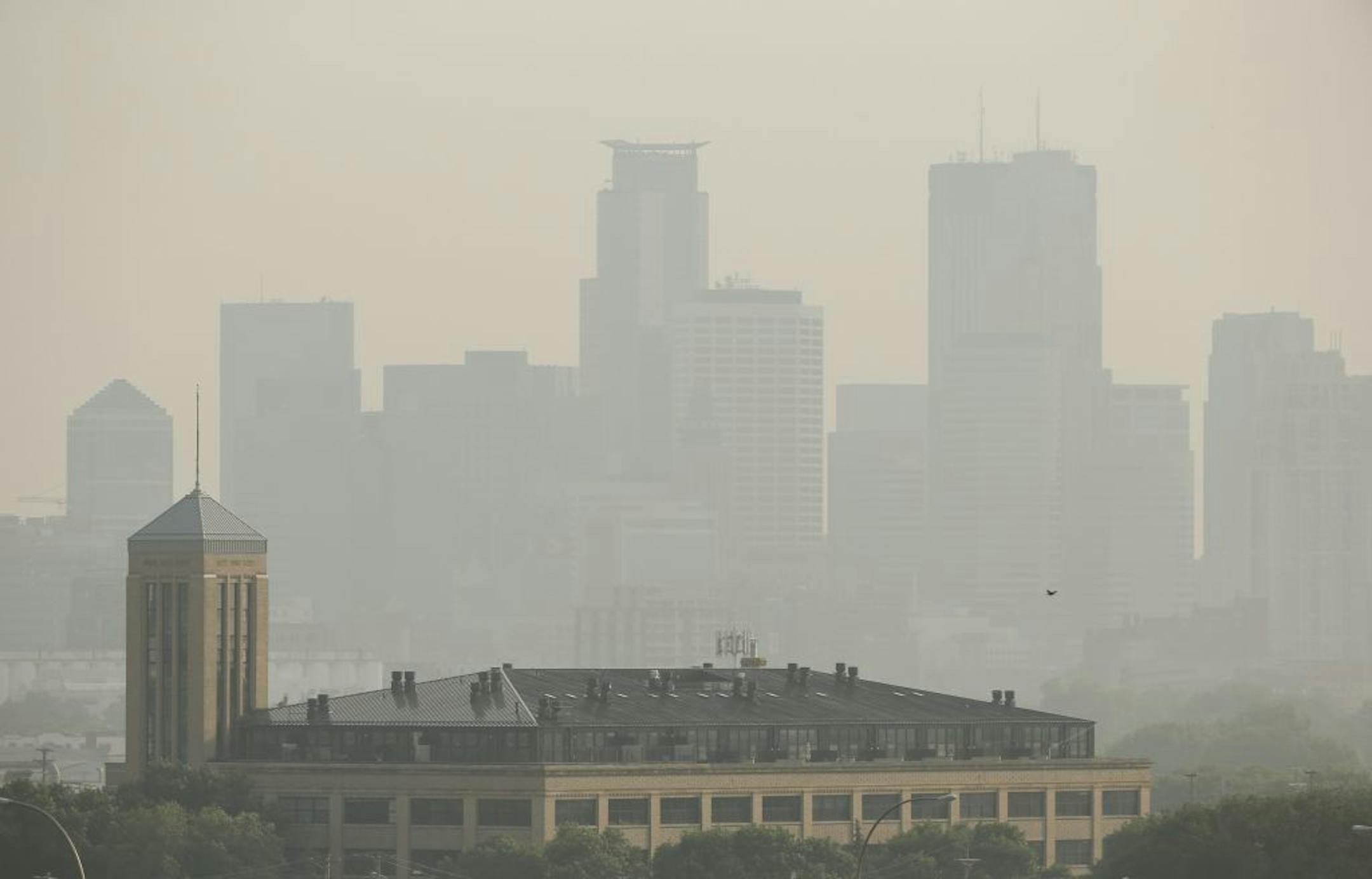 A haze settled in over the Minneapolis skyline one day in early July as smoke from Canadian wildfires drifted across Minnesota, leading to air quality warnings.