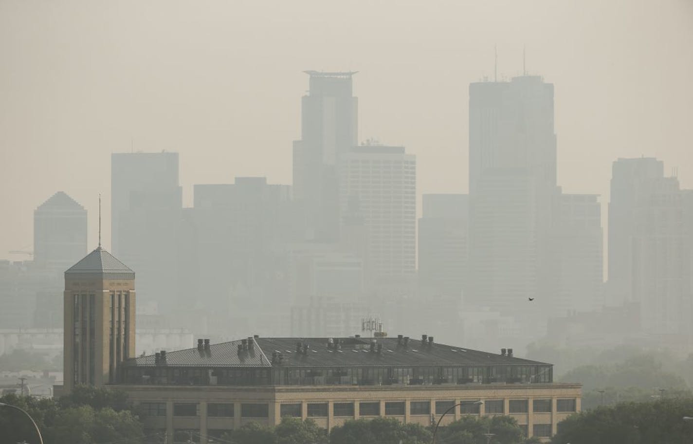 A haze settled in over the Minneapolis skyline one day in early July as smoke from Canadian wildfires drifted across Minnesota, leading to air quality warnings.