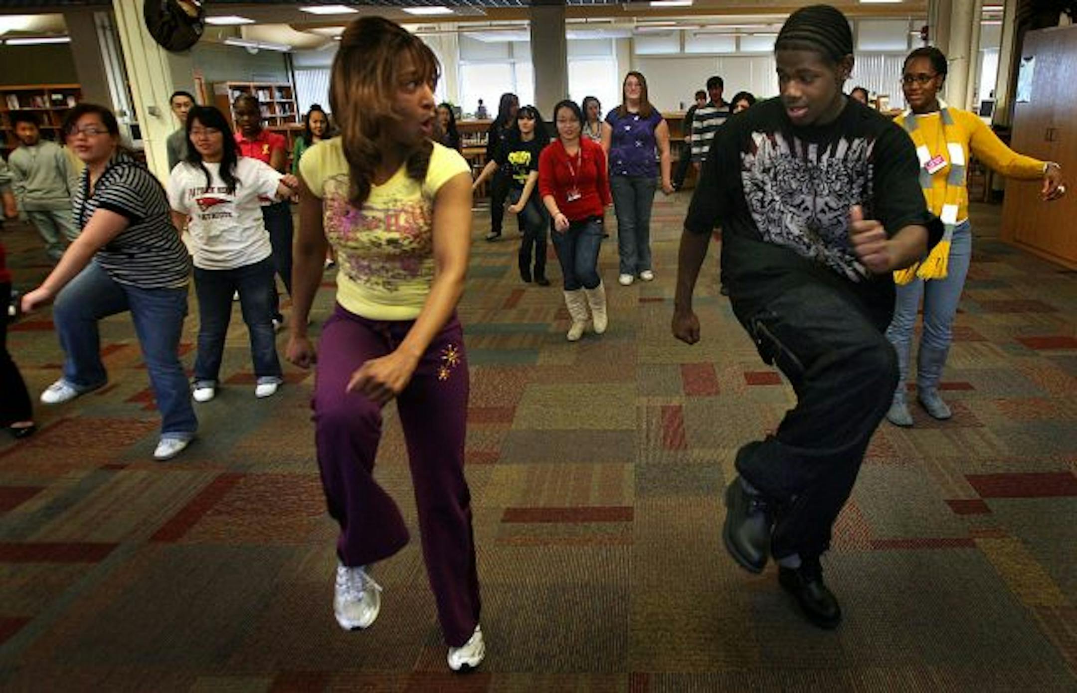 They don't slow down at Patrick Henry High School. Senior Dianta Halbert, 18, right, learned some fancy hip-hop dance moves from Sheila St. James during the school's first annual Community Involvement Day. Students had the opportunity to learn about a variety of subjects from guest presenters.