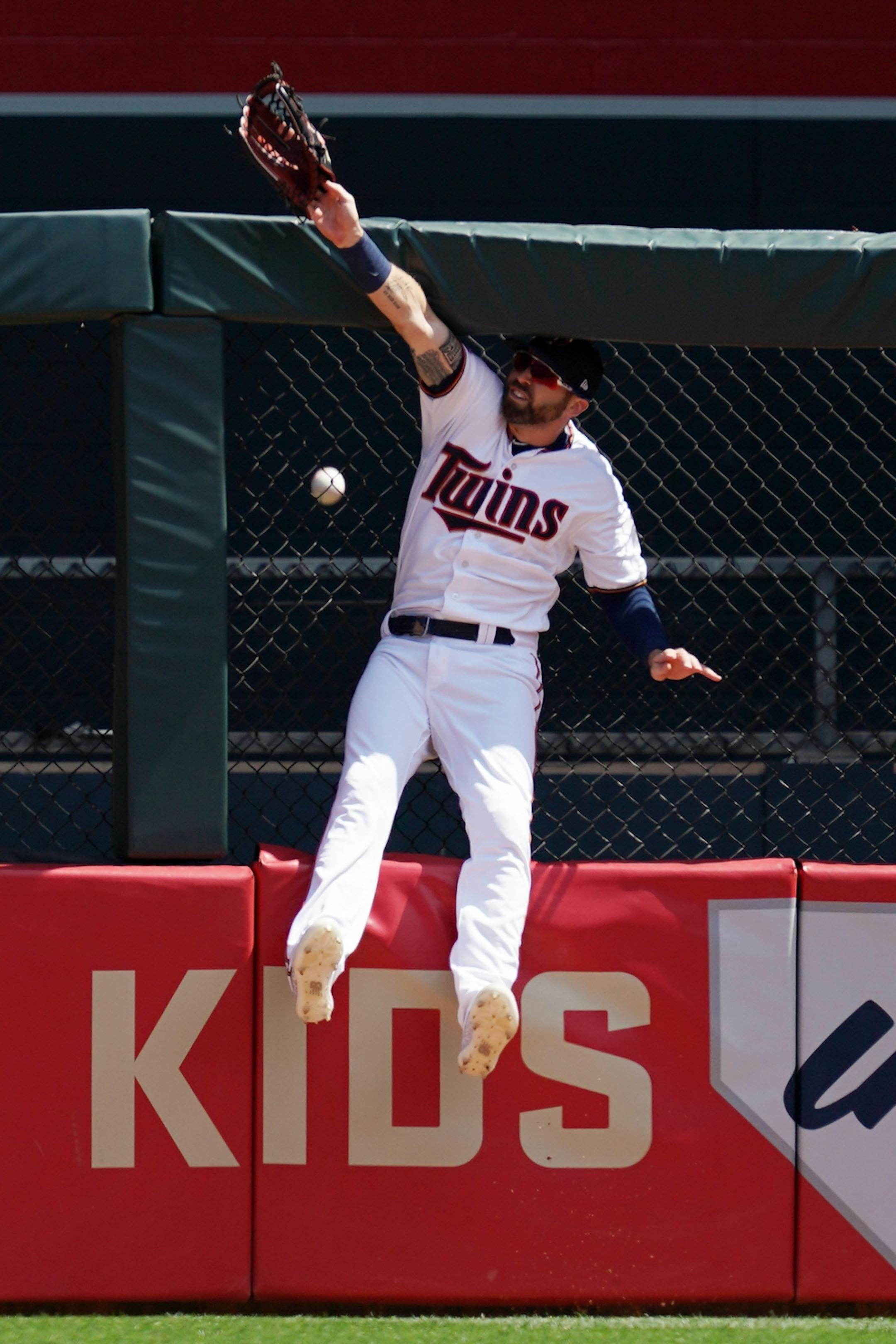 Minnesota Twins center fielder Jake Cave (60) leapt but was unable to field a solo home run hit by Atlanta Braves first baseman Freddie Freeman (5) in the first inning.
