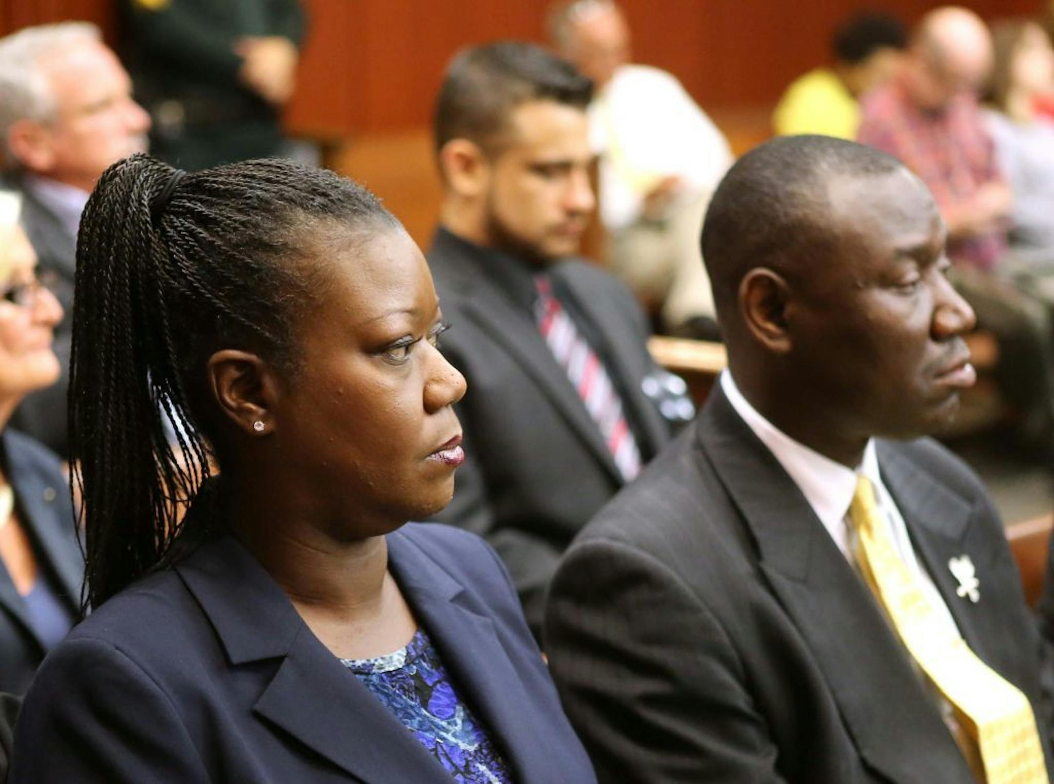 Sybrina Fulton, the mother shooting victim Trayvon Martin, sits with with her attorney Benjamin Crump, during a pre-trial hearing for George Zimmerman, the accused shooter of Trayvon Martin, Tuesday, May 28, 2013 in Sanford, Fla. Zimmerman has been charged with second-degree murder for the 2012 shooting death of Trayvon Martin. He was not in court for the hearing.