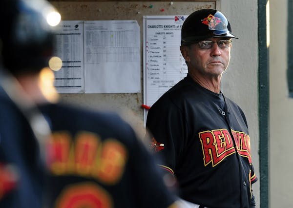 Rochester Red Wings' manager Gene Glynn watches from the dugout during game against the Charlotte Knights at Frontier Field on Monday, June 25, 2012.