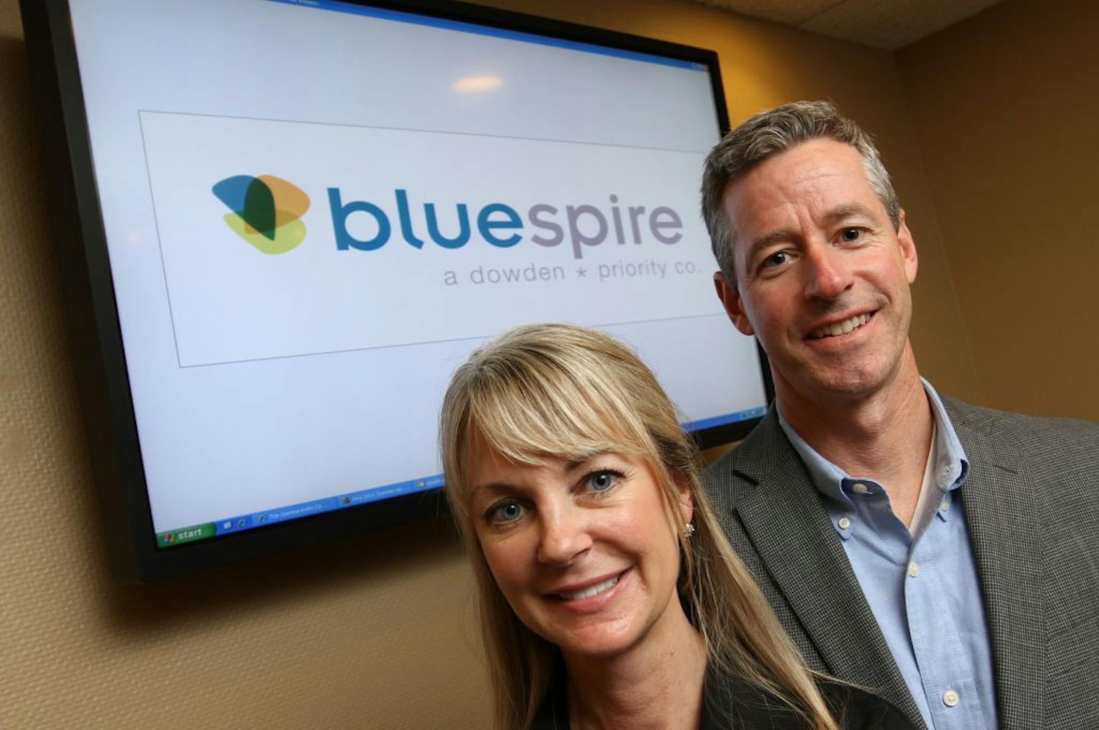 (left to right) Bluespire President Kathryn Hammond and Executive Vice President Jim Larranaga were photographed at the Edina offices on 5/24/12.