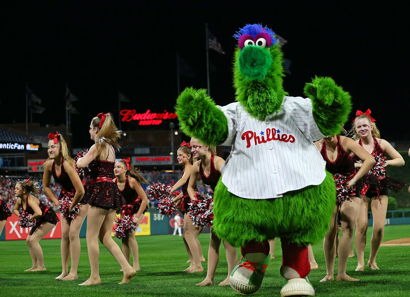 The Phillie Phanatic dances with a local dance team during a game between the Atlanta Braves and Phillies at Citizens Bank Park on September 29, 2018, in Philadelphia. (Rich Schultz/Getty Images/TNS) **FOR USE WITH THIS STORY ONLY** ORG XMIT: 1379818