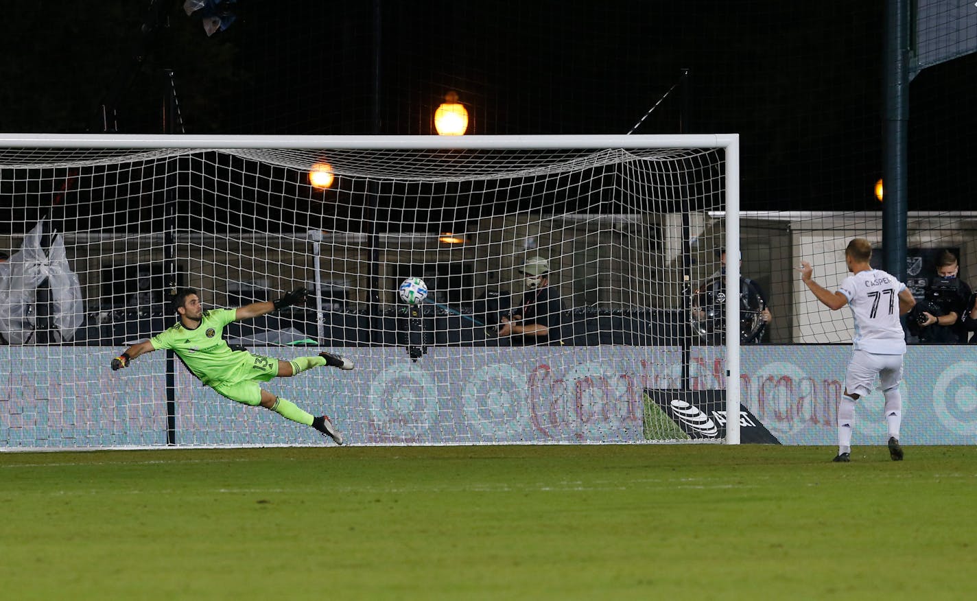 Minnesota United defender Chase Gasper makes the game-winning penalty kick after Columbus Crew goalkeeper Andrew Tarbell was unable to stop the shot