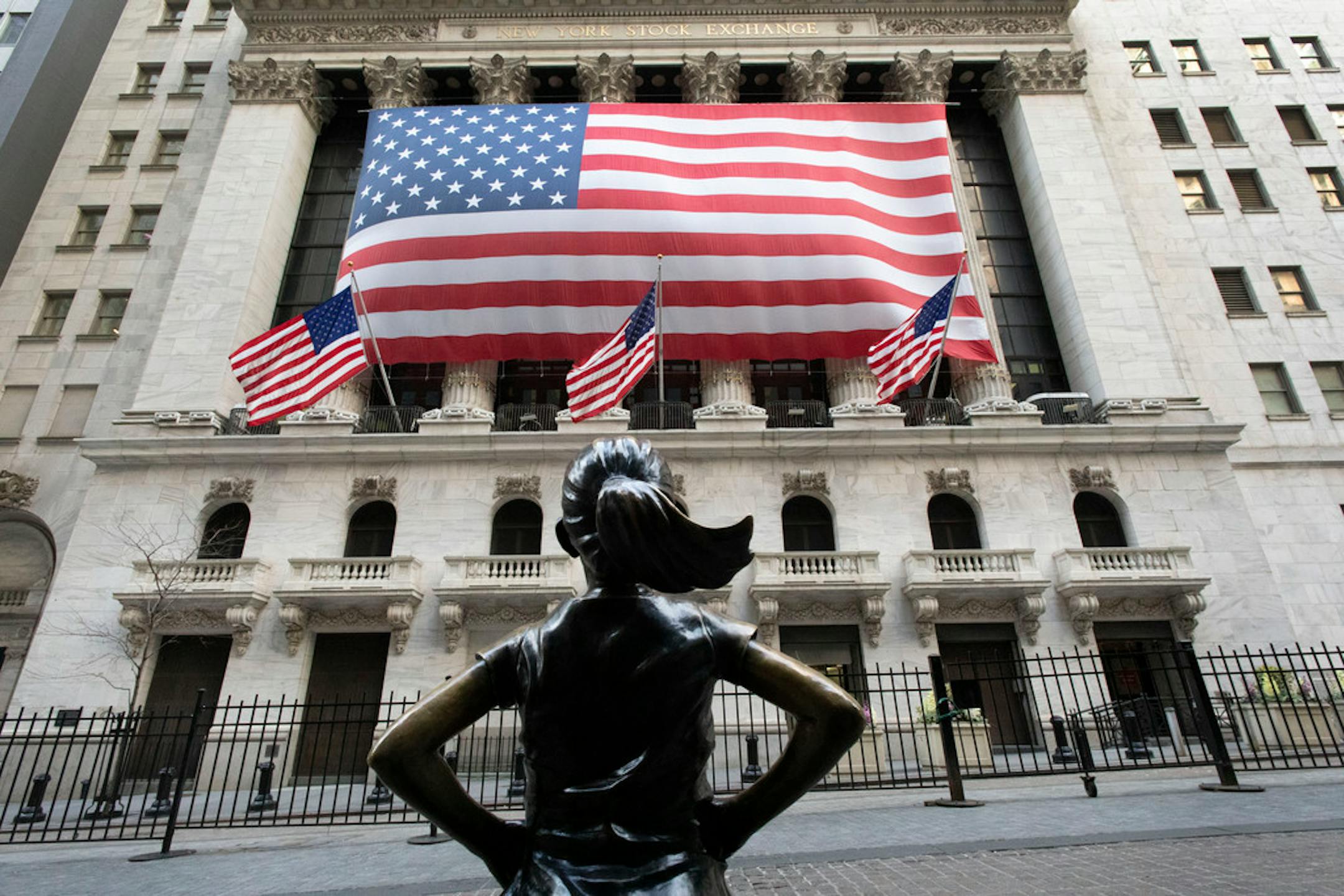The Fearless Girl statue stands in front of the New York Stock Exchange, Monday, March 16, 2020 in New York.