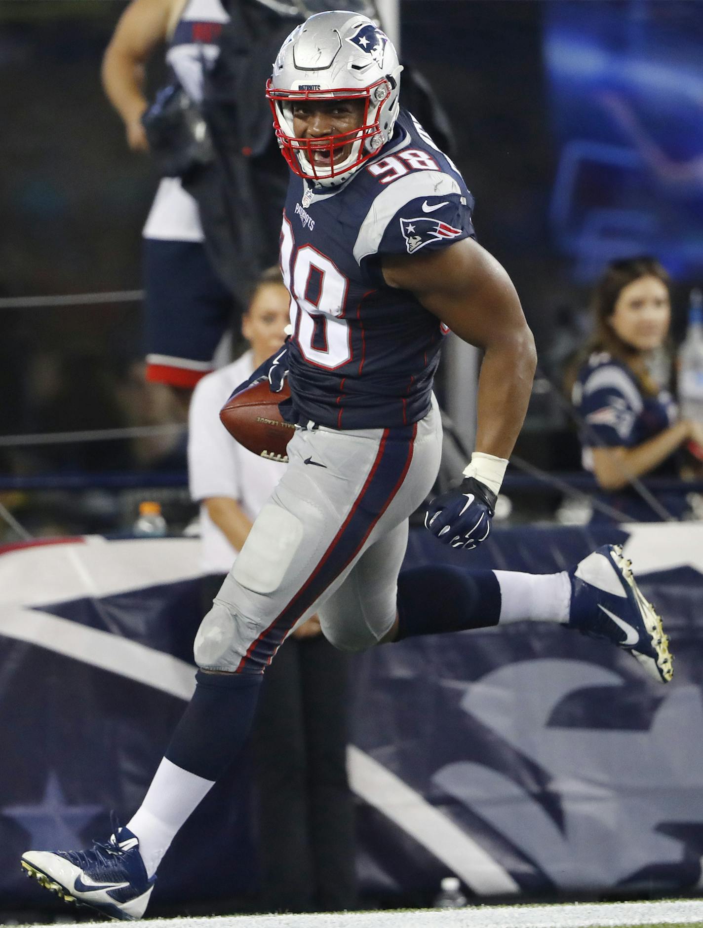 New England Patriots defensive lineman Trey Flowers celebrates after recovering a fumble by New Orleans Saints quarterback Luke McCown and running for a touchdown during the second half of a preseason NFL football game Thursday, Aug. 11, 2016, in Foxborough, Mass. (AP Photo/Winslow Townson) ORG XMIT: FBO141