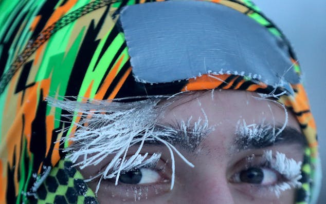 University of Minnesota student Daniel Dylla was frosted in the morning cold while pausing from a jog along the Mississippi River Tuesday, Jan. 29, 20