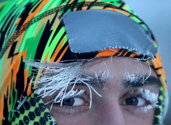University of Minnesota student Daniel Dylla was frosted in the morning cold while pausing from a jog along the Mississippi River Tuesday, Jan. 29, 20