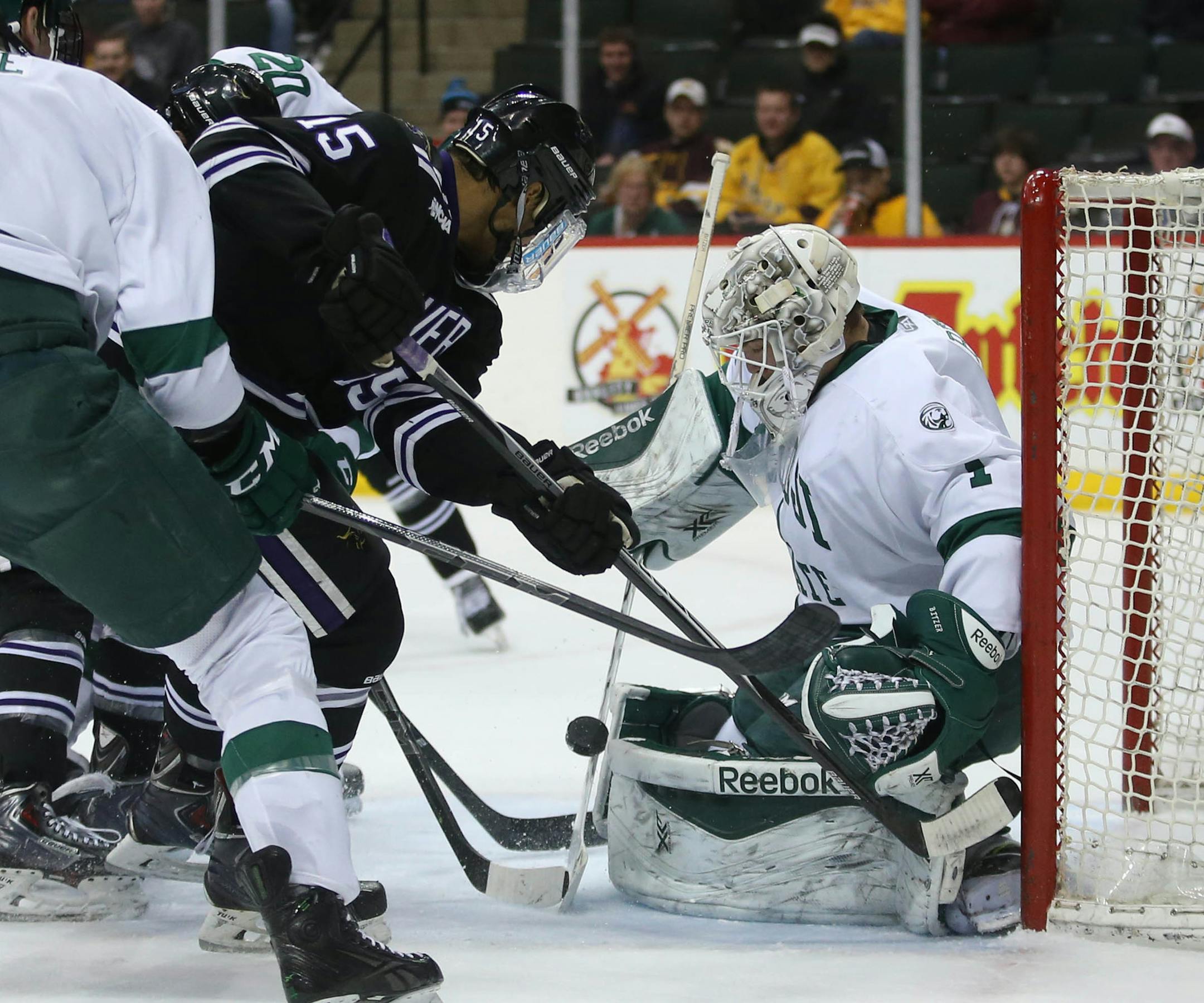 Minnesota State's C.J. Franklin attempted to score on Bemidji State's goalie Michael Bitzer during the first period. ] (KYNDELL HARKNESS/STAR TRIBUNE) kyndell.harkness@startribune.com Bemidji State vs Minnesota State during the North Start College Cup finals at the Xcel Energy Center in St. Paul Min., Saturday, January 24, 2015.