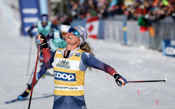 Jessie Diggins celebrated her victory in the women's 15km Mass Start freestyle World Cup race in Canmore, Alberta, on Friday.