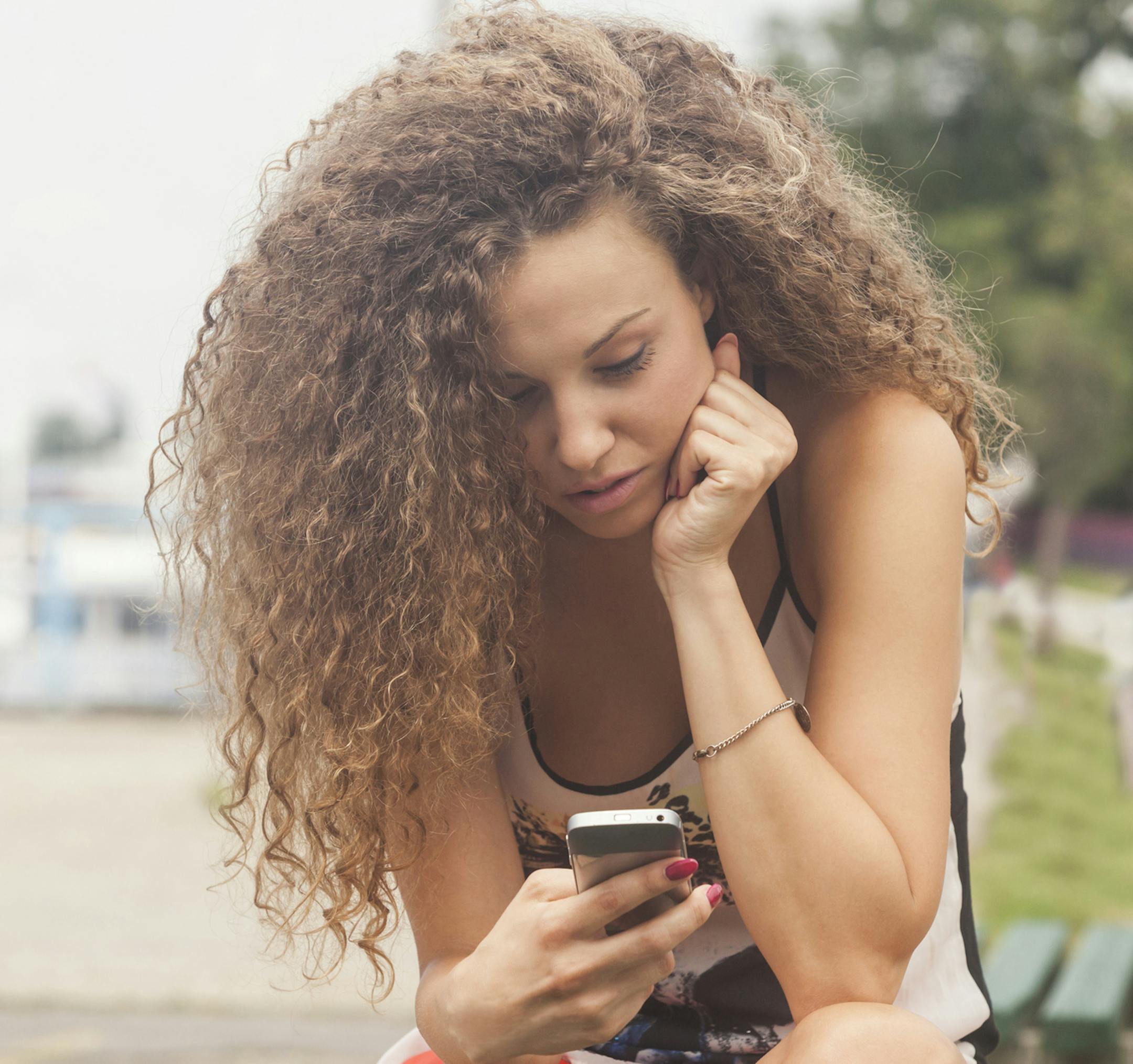 iStockphoto.com
Teenage girl texting on the phone.