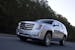The 2015 Cadillac Escalade doesn't shy from its gargantuan reputation, even offering a long-wheelbase version that adds 1 1/2 feet to its length.