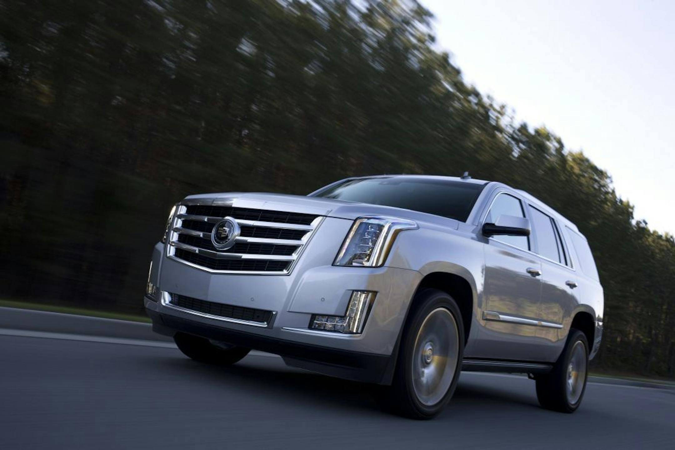 The 2015 Cadillac Escalade doesn't shy from its gargantuan reputation, even offering a long-wheelbase version that adds 1 1/2 feet to its length.
