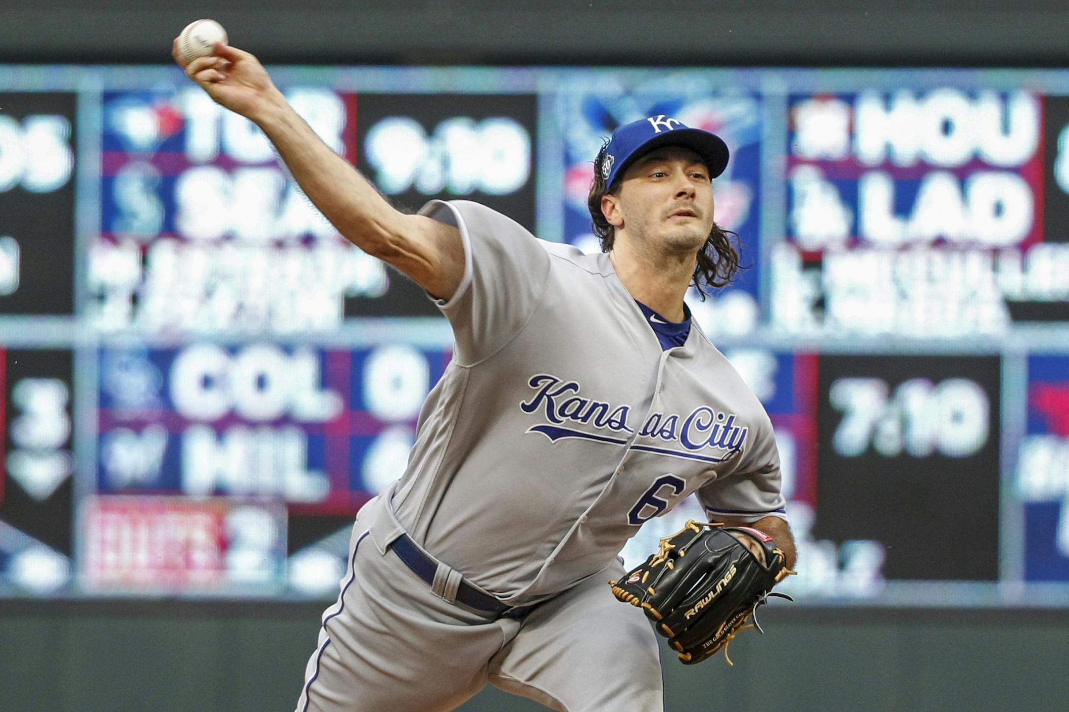 Kansas City Royals starting pitcher Burch Smith (64) throws to the Minnesota Twins in the first inning of a baseball game Saturday, Aug. 4, 2018, in Minneapolis.