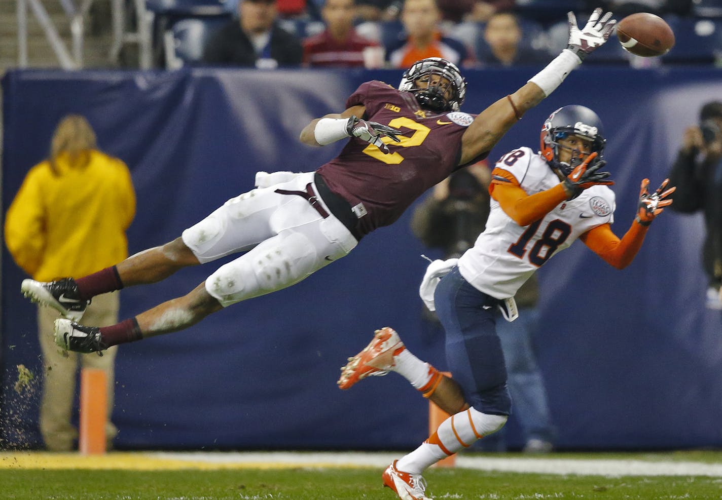 Minnesota Gophers vs. Syracuse Orange in Texas Bowl. Fans and band members whoop it up as the Gophers and head coach Jerry Kill make their way into Reliant Stadium. Syracuse completed a pass to Christopher Clark to set up a first half touchdown beating Minnesota defender Cedric Thompson (2) on the play. (MARLIN LEVISON/STARTRIBUNE(mlevison@startribune.com)