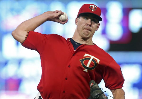 Minnesota Twins pitcher Trevor May throws in relief against the Kansas City Royals during the fifth inning of a baseball game Friday, Sept. 7, 2018, i
