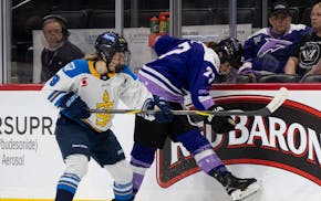 Frost forward Taylor Heise (27) uses her skate to direct the puck after losing her stock against Toronto Sceptres forward Daryl Watts (9) during the f