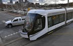 A streetcar to be delivered to Kansas City is offloaded from its trailer on Wednesday, Feb. 3, 2016, in Kansas City, Mo. The city is on schedule to be