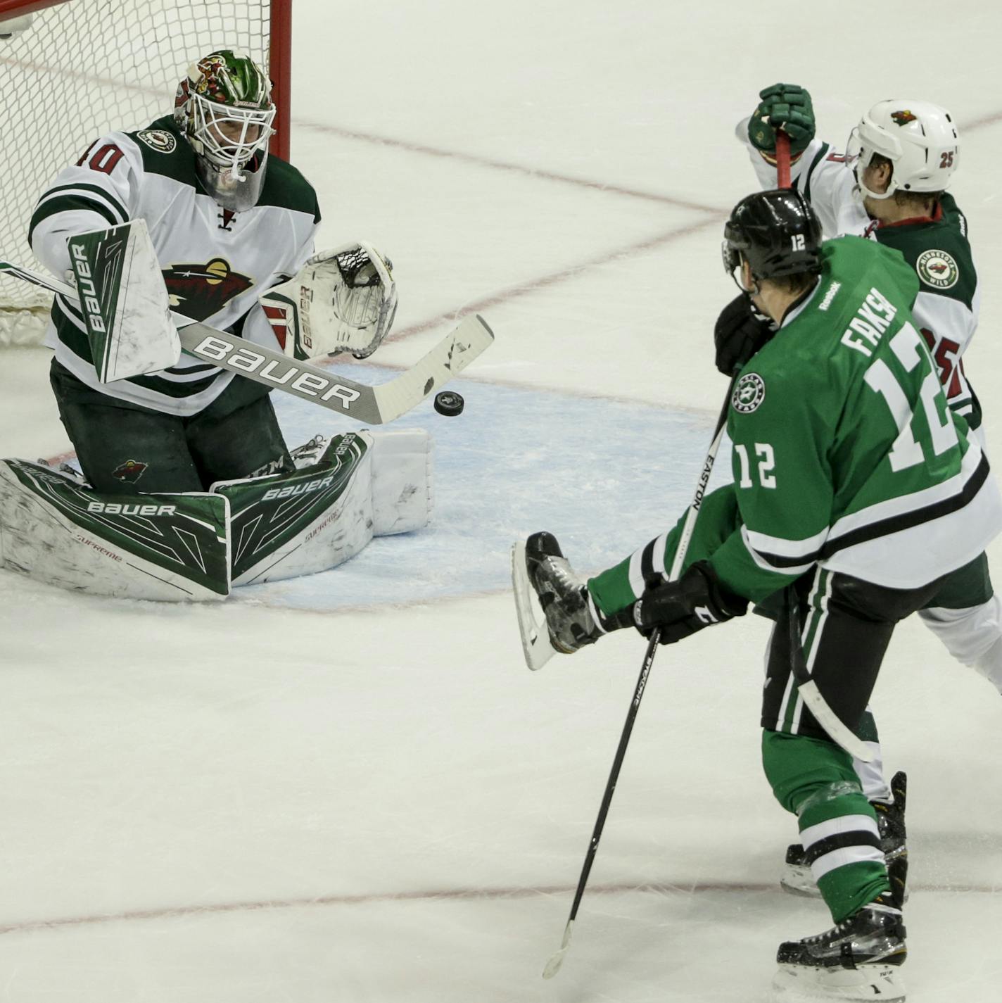 April 16, 2016: Minnesota Wild goalie Devan Dubnyk (40) blocks a shot by Dallas Stars center Radek Faksa (12) during the first period of the NHL Western Conference Quarter Finals Playoff game between the Minnesota Wild and the Dallas Stars at the American Airlines Center in Dallas, TX. The Stars and Wild are tied 0-0 Tim Warner/CSM. (Cal Sport Media via AP Images) ORG XMIT: CSMAP