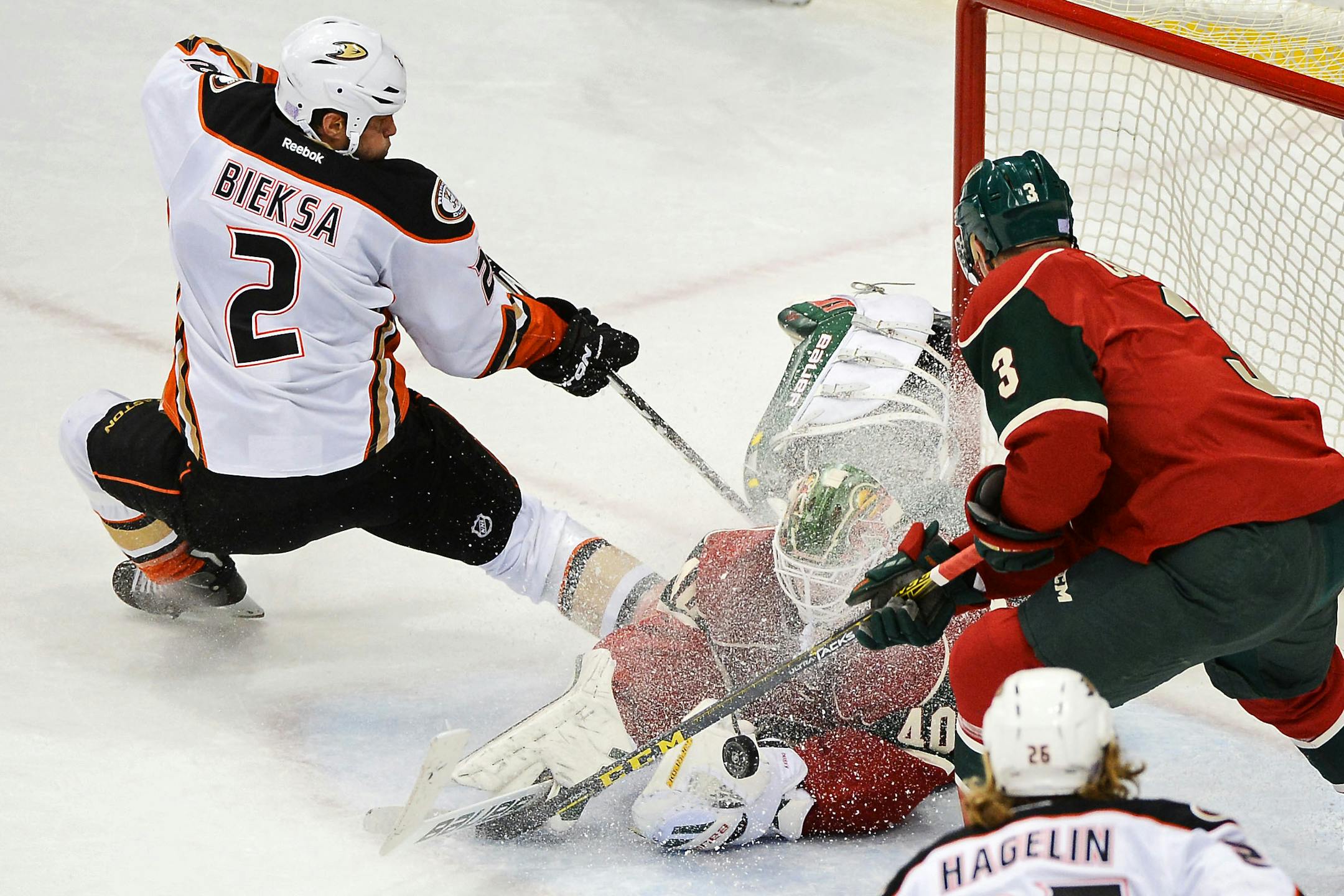 Minnesota Wild goalie Devan Dubnyk (40) made a tough save off a shot by Anaheim Ducks defenseman Kevin Bieksa (2) in the first period.